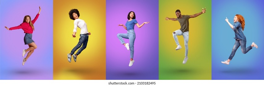 Full length of joyful millennial international people jumping together, smiling at camera over bright neon studio backgrounds, panorama. Young guys and ladies celebrating success and having fun - Shutterstock ID 2103182495