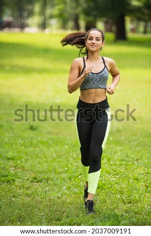 Similar – Fit muscular woman working out in a park