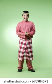 Full Length Of Malay Man With Traditional Costume