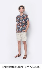 Full Length
Man Casual Summer Wearing New Stylish Floral ,palm,leaves Printed Printed Shirts With Khaki Pants Shorts And Flip Flop,hat With Hands Holds Pockets
