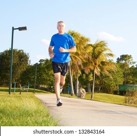 Full Length Of A Mature Man Jogging. Horizontal Shot.