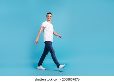 Full Length Phoro Of Amazing Attractive Young Guy Walking Down Street Isolated On Blue Pastel Color Background