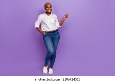 Full Length Photo Of Adorable Cute Lady Wear Smart Casual Look Pointing Empty Space Isolated Purple Color Background