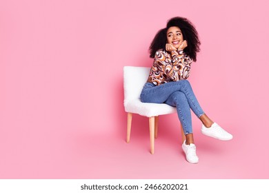 Full length photo of adorable dreamy girl wear print shirt sitting stool hands cheekbones looking empty space isolated pink color background - Powered by Shutterstock