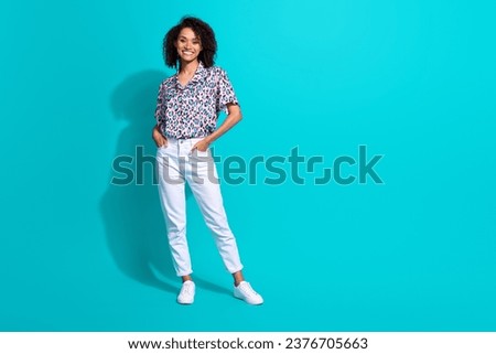 Full length photo of adorable lovely girl dressed nice outfit standing empty space proposition ad isolated on cyan color background