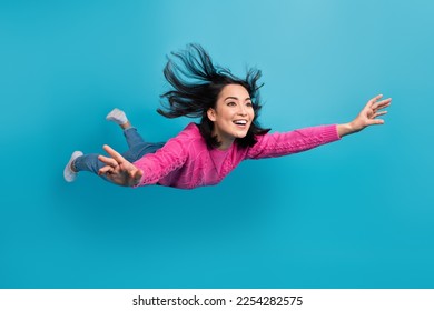 Full length photo of adorable pretty lady wear pink pullover falling air isolated blue color background - Shutterstock ID 2254282575