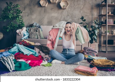 Full Length Photo Of Angry Furious Girl Prepare Valentine Day Party Hold Dressing Have No Idea What Wear Scream Sit Floor Carpet Legs Crossed Folded In House Indoors