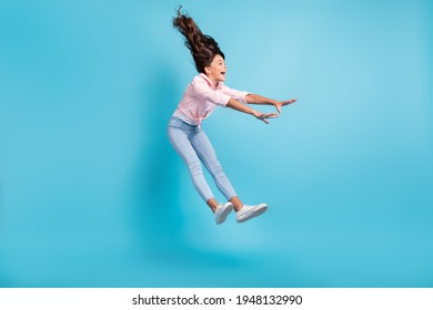 Full Length Photo Of Astonished Carefree Kid Playing Jumping Falling Open Mouth Isolated On Blue Color Background