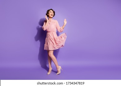 Full length photo of astonished girl have summer weekend walk look copy space impressed hold hand scream wear pastel clothes isolated over shine color background - Shutterstock ID 1734347819