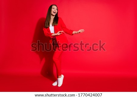 Full length photo of attractive funny lady successful worker having fun dance party colleagues event meeting good mood wear blazer suit pants shoes isolated red color background