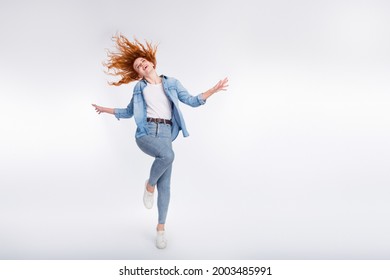 Full Length Photo Of Attractive Young Positive Woman Jump Up Enjoy Wind Blow Hair Isolated On Grey Color Background