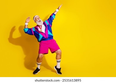 Full length photo banner of sportive cheerful old man dance golden medal dressed retro sportswear isolated on yellow color background - Powered by Shutterstock