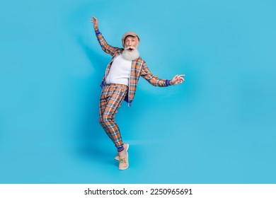 Full length photo of carefree crazy retired gentleman plaid stylish costume risk stand high dangerous isolated on blue color background