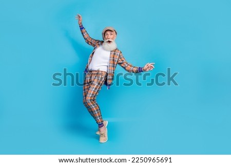 Full length photo of carefree crazy retired gentleman plaid stylish costume risk stand high dangerous isolated on blue color background