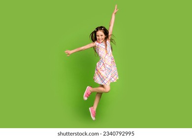 Full length photo of cheerful crazy energetic girl dressed trendy clothes rejoice seasonal offer isolated on green color background - Powered by Shutterstock