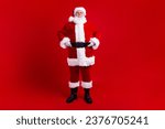 Full length photo of cheerful good mood santa claus winter magic season new year time isolated on red color background