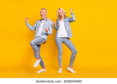 Full Length Photo Of Cheerful Happy Old People Spouses Winner Celebrate Enjoy Isolated On Yellow Color Background