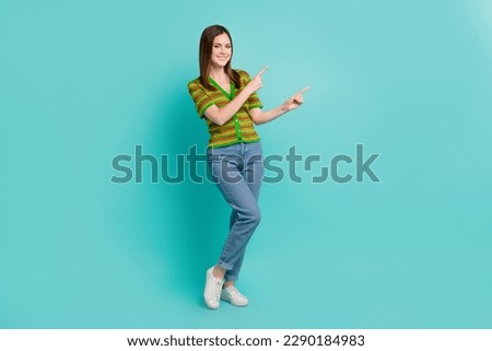 Full length photo of cheerful nice pretty lady two arm direct empty space nice quality clothes isolated on cyan color background