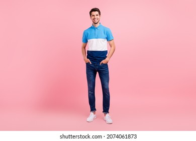 Full Length Photo Of Cool Brunet Young Guy Stand Wear Polo Jeans Sneakers Isolated On Pink Background