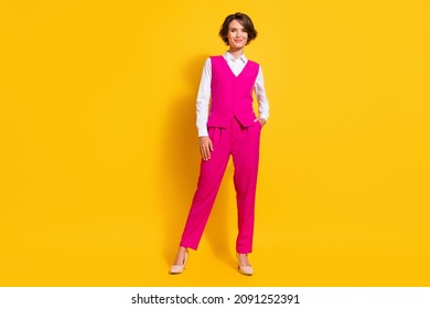 Full Length Photo Of Cool Millennial Brunette Lady Pose Wear Pink Suit Stilettos Isolated On Yellow Background