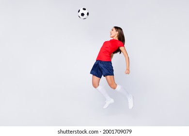 Full length photo of crazy air fly fun joy defender position soccer team game jump up pass ball with chest wear Spain uniform t-shirt shorts cleats knee socks isolated white color background - Powered by Shutterstock