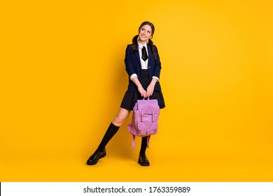 Full Length Photo Of Curious Consider High School Girl Hold Backpack Look Copyspace Enjoy Academic Lesson Schedule Isolated Over Bright Shine Color Background