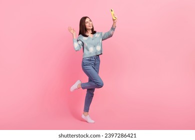 Full length photo of cute excited woman dressed teal outfit video call modern gadget waving hi arm isolated pink color background - Powered by Shutterstock