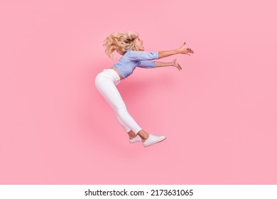 Full Length Photo Of Cute Funny Lady Wear Off Shoulders Top Jumping High Catching Falling Object Isolated Pink Color Background