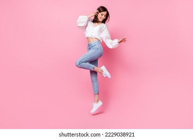 Full length photo of cute lady skinny figure look empty space footwear satisfied trendy purchase outfit isolated on pink color background