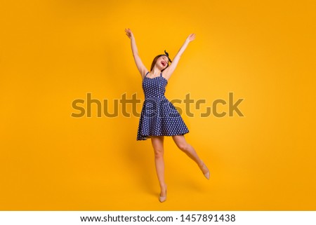 Full length photo of cute youth raise hands arms close eyes isolated over yellow background