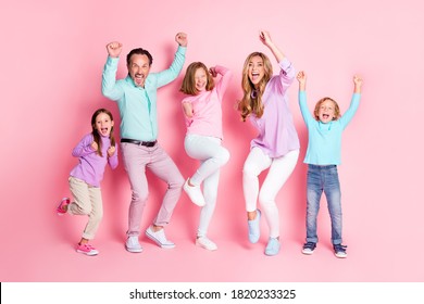 Full length photo ecstatic dad mom and three little preteen kids enjoy rejoice win family game raise fists scream wear casual style clothes isolated pastel color background - Shutterstock ID 1820233325