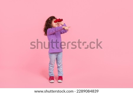 Similar – Image, Stock Photo kid looking to the camera, holding hands with his parents, closeup portrait. View from above.