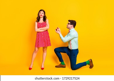 Full length photo frustrated geek man propose give ring girl cross hands indifferent wear red dotted dress mini short legs suspenders shirt trousers isolated bright shine color background