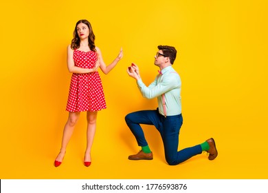 Full Length Photo Of Frustrated Girl Reject Guy Give Her Jewelry Ring Propose Marry Wear Red Dotted Dress Sort Mini Legs High-heels Suspenders Shirt Isolated Over Bright Shine Color Background