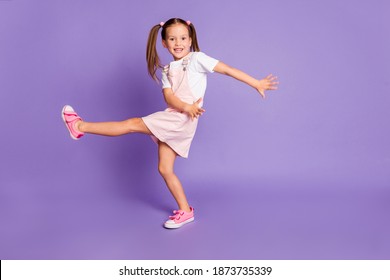 Full length photo of funky crazy girl dance cool wear pink dress white t-shirt isolated on violet color background