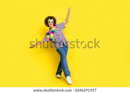 Full length photo of funky excited lady dressed print shirt pineapple sunglass walking empty space isolated yellow color background