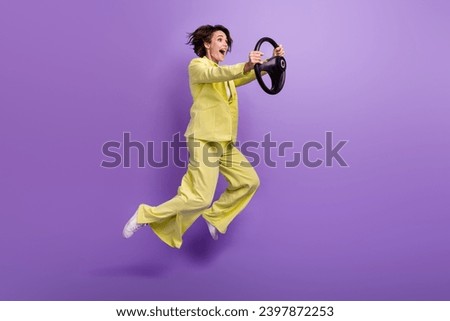 Full length photo of funky pretty woman dressed yellow jacket jumping high riding vehicle isolated purple color background