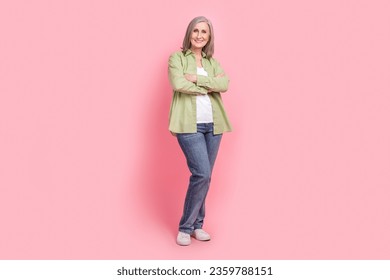 Full length photo of gorgeous lovely lady wear green stylish clothes arms folded dressed trendy clothes isolated on pink color background - Powered by Shutterstock