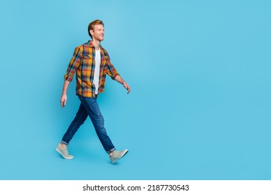 Full length photo of handsome man with ginger hair dressed stylish plaid shirt go shopping big sale isolated on blue color background - Shutterstock ID 2187730543