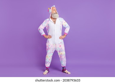 Full length photo of happy old man wear nightwear look empty space cool isolated on purple color background - Powered by Shutterstock