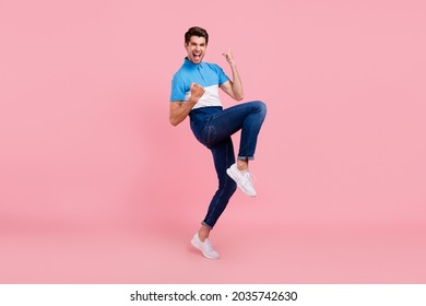 Full length photo of hooray brunet young guy stand wear polo jeans sneakers isolated on pink background