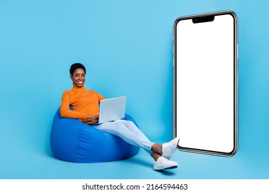 Full Length Photo Of Lesbian Nonbinary Businesswoman Working In Laptop Modern Technology Isolated On Blue Color Background