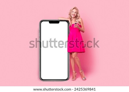Full length photo of lovely classy chic blogger dressed stylish outfit presenting empty space novelty isolated on pink color background