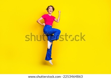 Full length photo of lovely positive lady wear trendy clothes shout hooray yes cool offer empty space isolated on yellow color background