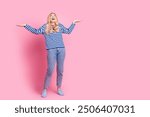 Full length photo of mature lady catch hands rainy look up empty space dressed stylish striped garment isolated on pink color background