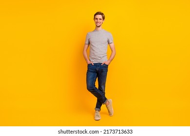 Full Length Photo Of Nice Charismatic Macho Guy Hands Pockets Travel Isolated Over Vibrant Color Background