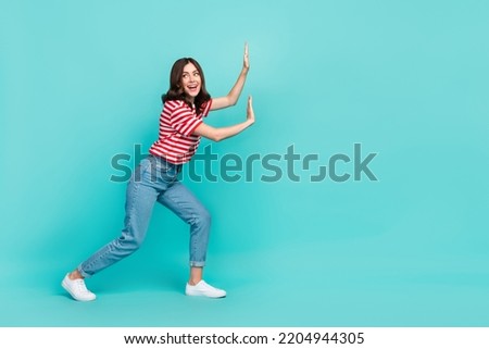 Full length photo of nice pretty lady hold carry touch empty space interested look promo isolated on aquamarine color background