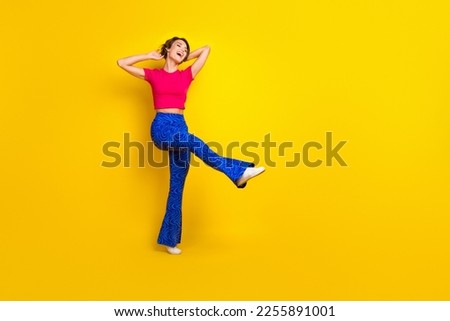 Full length photo of optimistic positive lady wear trendy clothes celebrate birthday empty space isolated on yellow color background