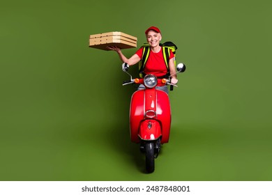 Full length photo of pensioner lady delivery service thermo bag scooter pizza dressed red uniform workwear isolated on khaki background - Powered by Shutterstock