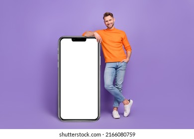 Full length photo of positive businessman lean on white telephone promo card isolated on purple color background - Shutterstock ID 2166080759
